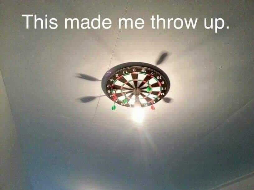 Funny meme picture of dartboard on roof says "This made me throw up"