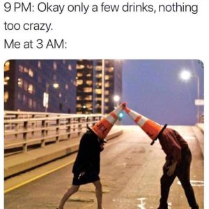 Two people dueling with traffic cones on their heads in the 'Funny Drinking Meme'.